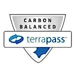 A shield-shaped badge with the words "Carbon Balanced" above the TerraPass logo, featuring blue arrows forming a circle—perfect for any pet lover or mobile dog grooming business committed to sustainability.